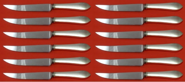 Tiffany & Co. Faneuil 12pc Sterling Silver Steak Knife Set Custom Made: Tiffany & Co. Faneuil 12pc Sterling Silver Steak Knife Set Custom Made Enhance your dining experience with this exquisite 12-piece steak knife set from Tiffany & Co., featuring the elegant Faneuil pat