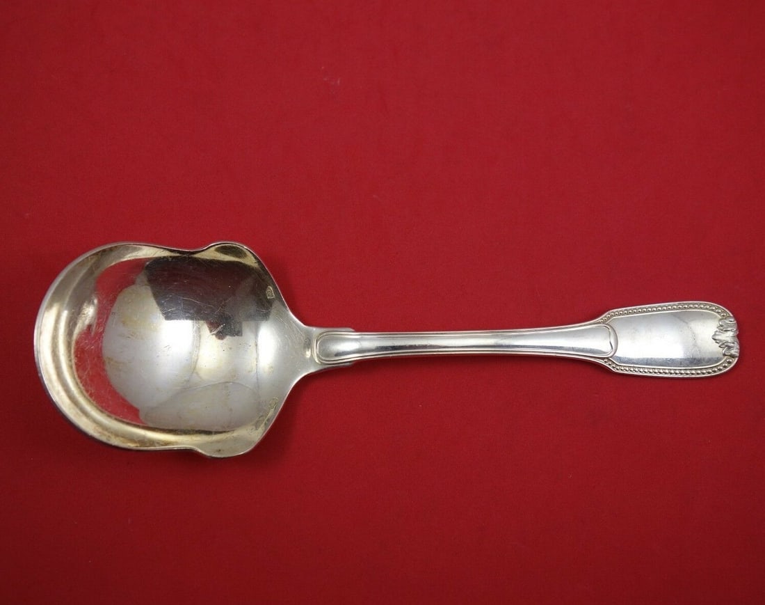 Christofle Joubert Sterling Silver Serving Spoon 8 Inch Wide Shoulders: Christofle Joubert Sterling Silver Serving Spoon 8 Inch Wide Shoulders Enhance your dining experience with this exquisite Joubert serving spoon by Christofle. Crafted from high-quality sterling silver