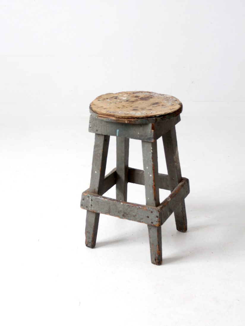 Handcrafted Vintage Rustic Wooden Stool with Gray Frame: Handcrafted Vintage Rustic Wooden Stool with Gray Frame Discover the charm of this vintage rustic wooden stool, expertly handcrafted for a unique touch. It features a well-worn paperboard seat complem