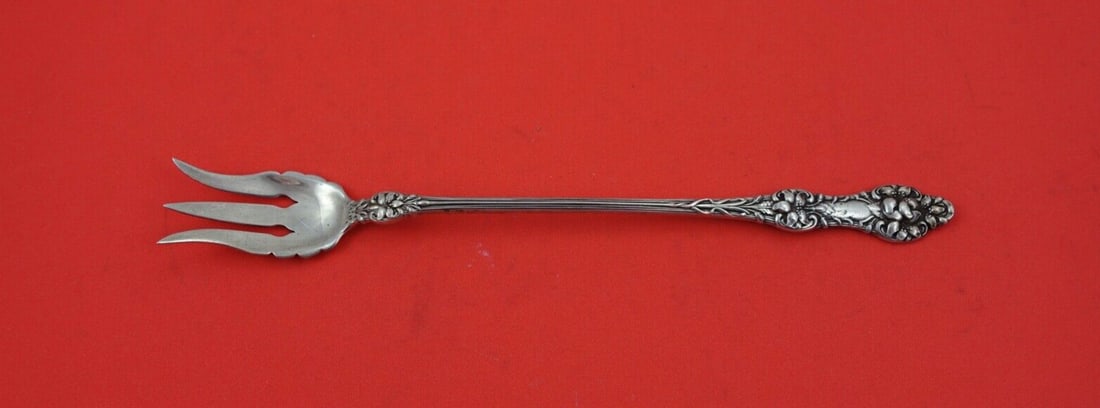 Gorham Old Orange Blossom Sterling Silver Pickle Fork 8 3/8": Gorham Old Orange Blossom Sterling Silver Pickle Fork 8 3/8" This exquisite Old Orange Blossom pickle fork, crafted by Alvin / Gorham, is a splendid addition to any table setting. Made of high-quality