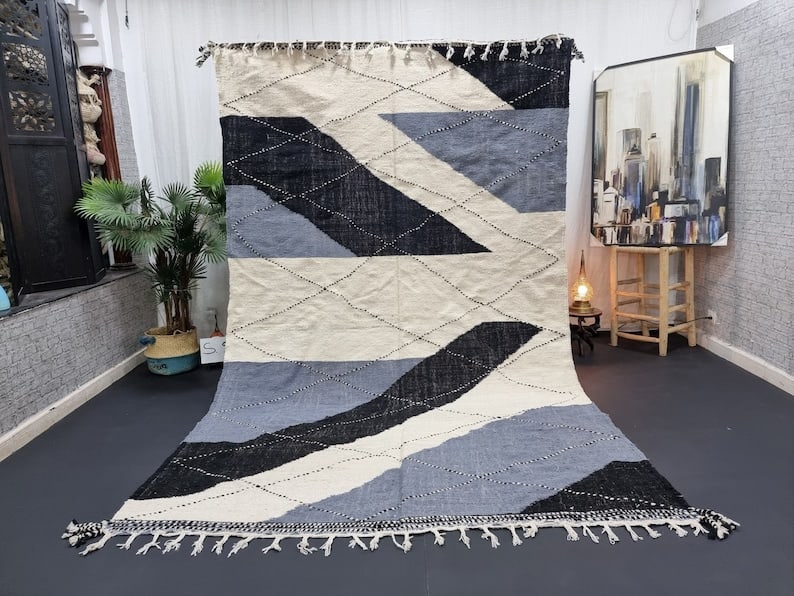 Authentic Handmade Moroccan Berber Wool Area Rug 9.84 x 6.56 Feet: Authentic Handmade Moroccan Berber Wool Area Rug 9.84 x 6.56 Feet Enhance your living space with this stylish authentic handmade Moroccan Berber wool area rug. This exquisite piece is handwoven by ski