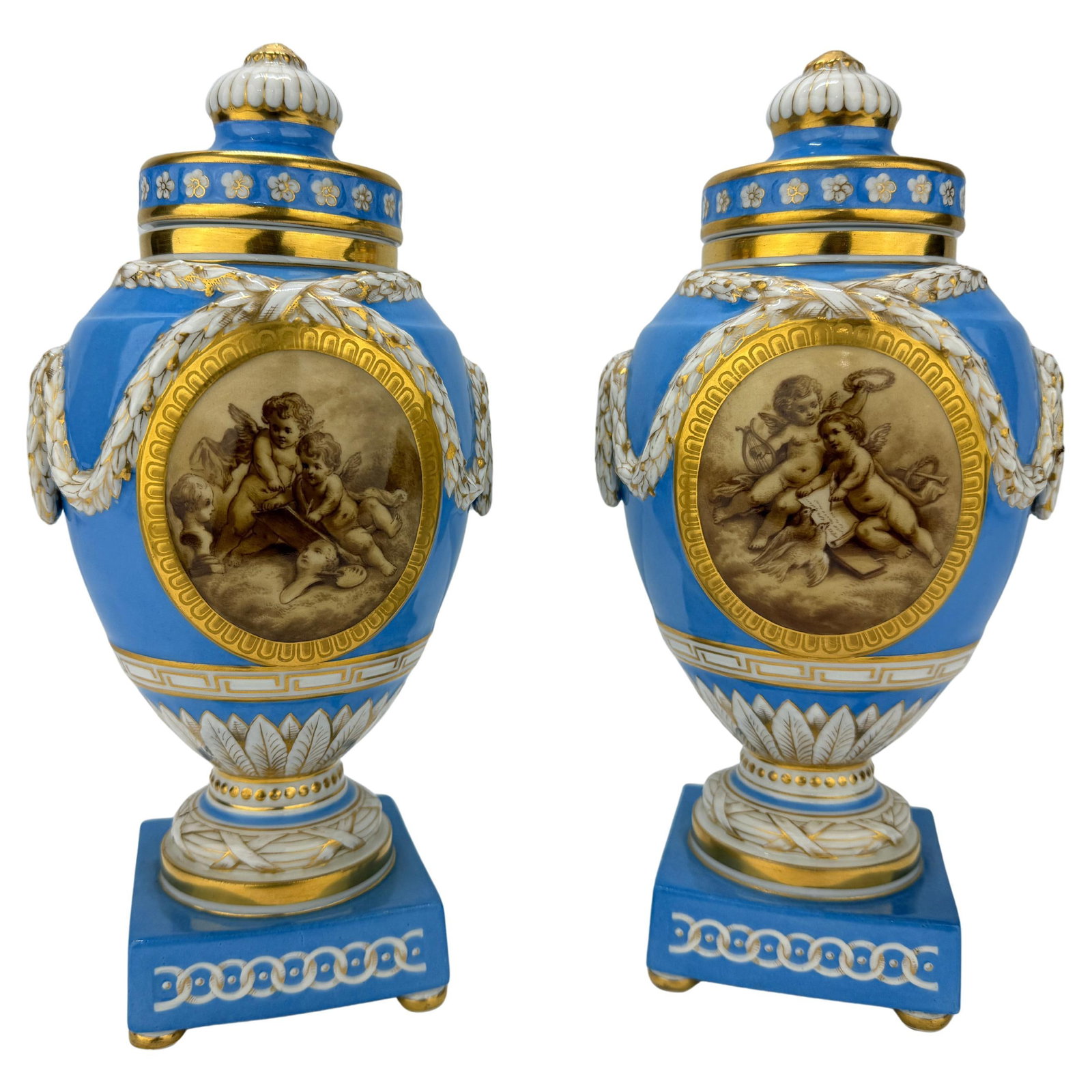 Pair of 19th C. KPM Celestial Blue & Grisaille Urns: Pair of 19th C. KPM Celestial Blue & Grisaille Urns This exquisite pair of 19th-century lidded urns, crafted by the esteemed Koenigliche Porzellan-Manufaktur (KPM) of Berlin, showcases the Neoclassica