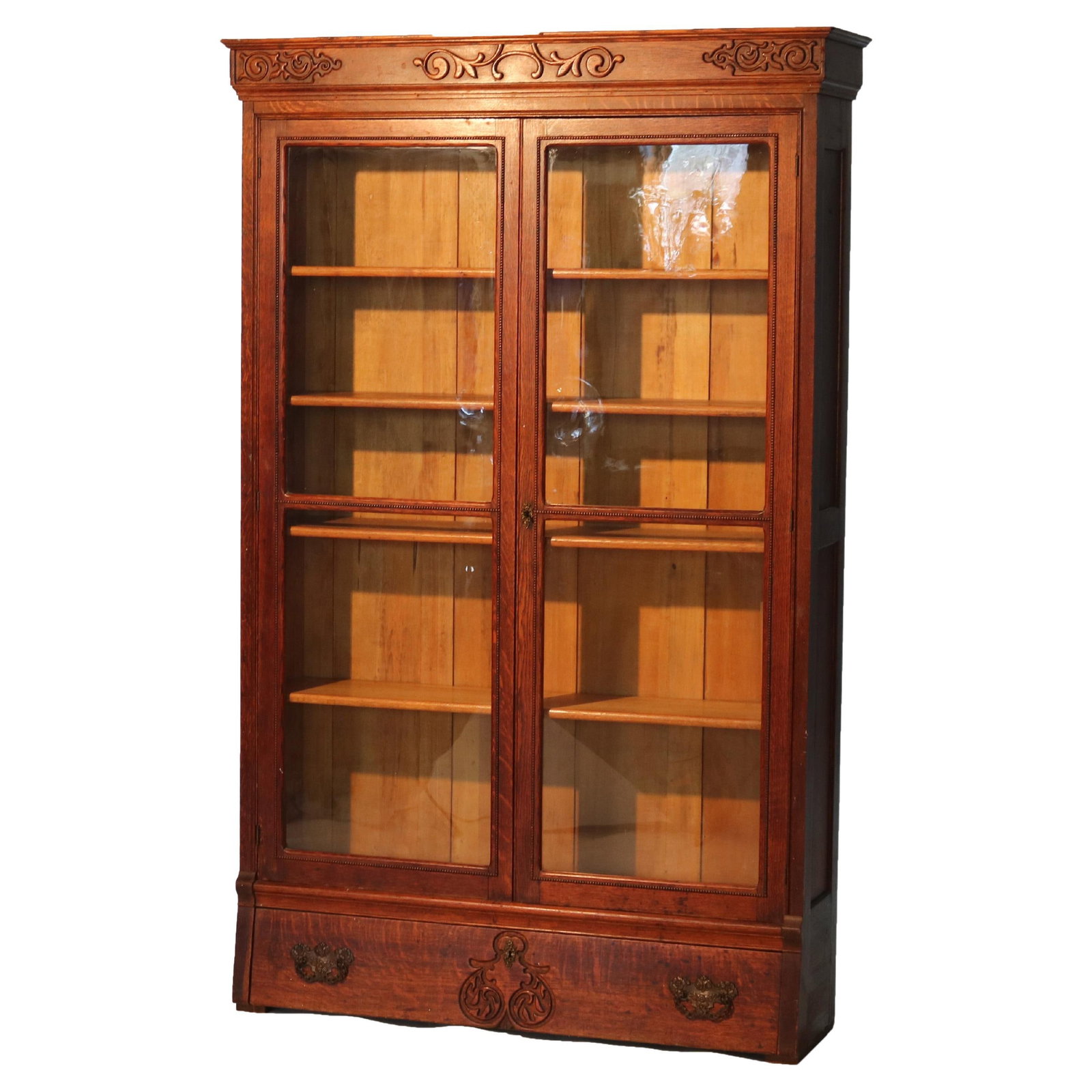 Antique RJ Horner Carved Oak Bookcase c1910 Two-Door One-Drawer: Antique RJ Horner Carved Oak Bookcase c1910 Two-Door One-Drawer This oversized antique bookcase, attributed to RJ Horner, showcases exquisite carved oak detailing characteristic of the early 20th cent