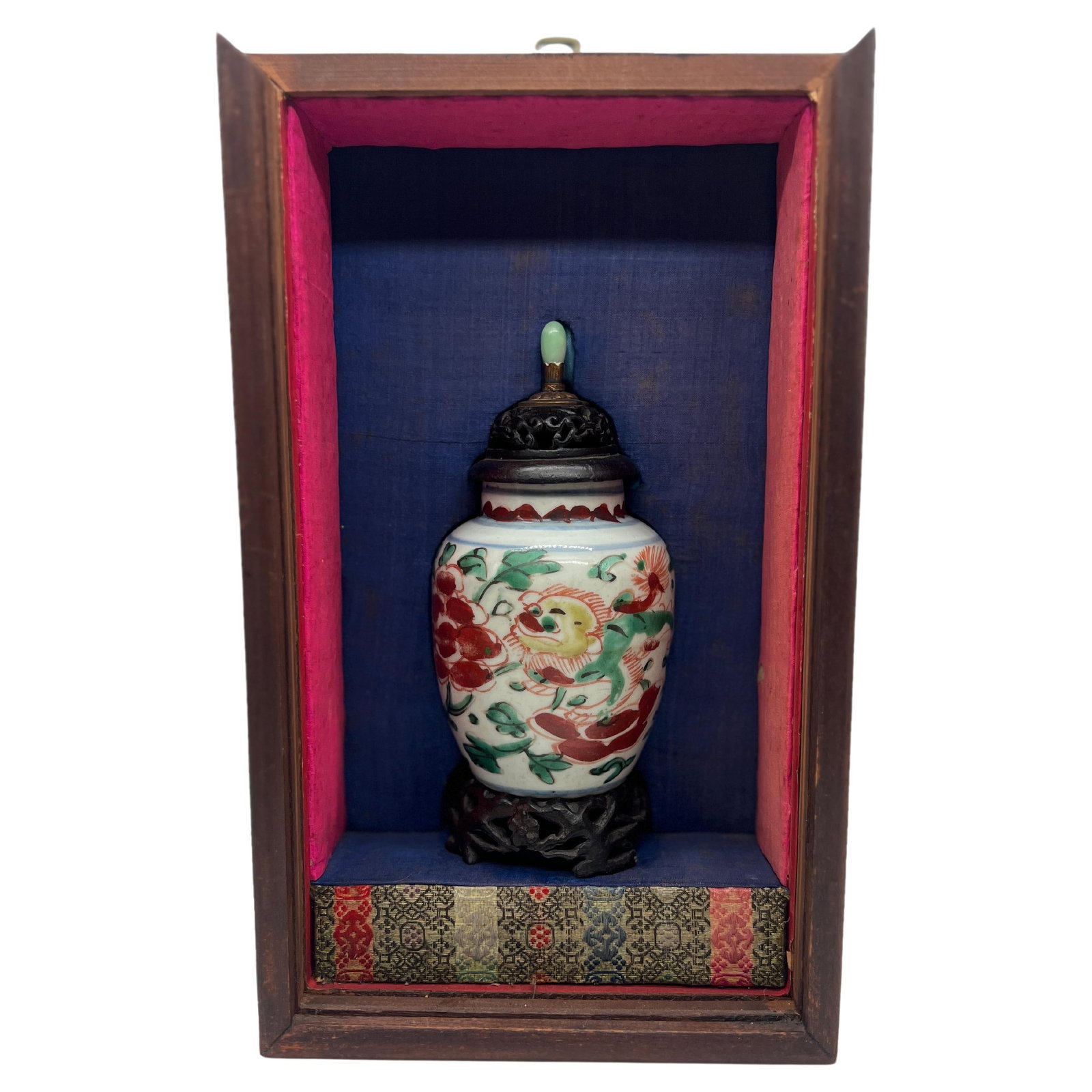 19th Century Chinese Wucai Porcelain Vase with Rosewood Stand and Jade Finial: 19th Century Chinese Wucai Porcelain Vase with Rosewood Stand and Jade Finial This stunning Chinese porcelain Wucai vase showcases exquisite craftsmanship and vibrant polychrome decoration. Dating bac