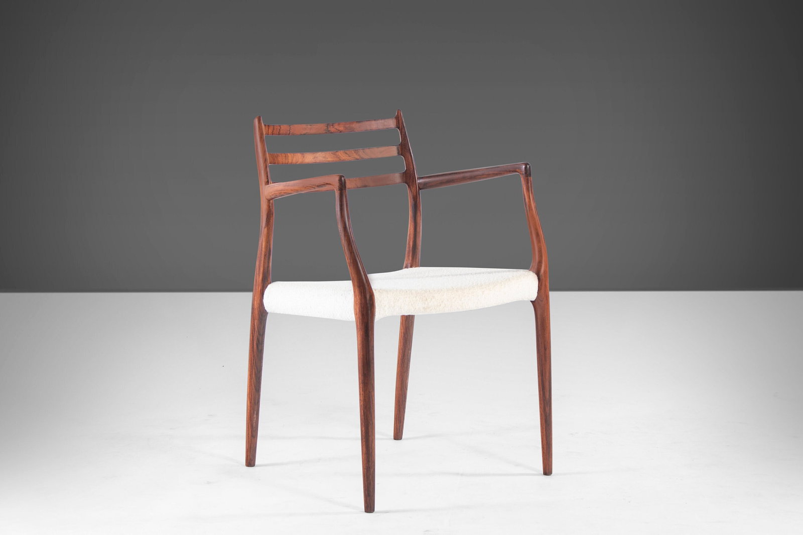 Model 62 Danish Rosewood Arm Chair by Niels Moller Knoll Boucle 1960s: Model 62 Danish Rosewood Arm Chair by Niels Moller Knoll Boucle 1960s Introducing the Model 62 Rosewood Arm Chair, a stunning piece designed by Niels Moller for J.L. Mollers Mobelfabrik in the 1960s.