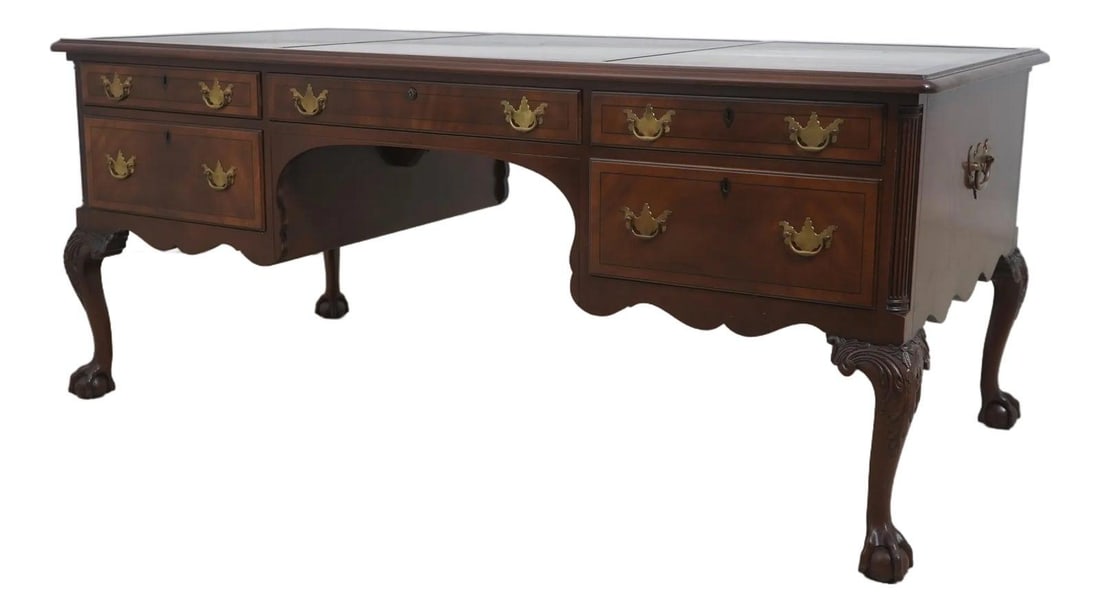 Mahogany Executive Desk in Chippendale Tradition with Ball and Claw Feet: Mahogany Executive Desk in Chippendale Tradition with Ball and Claw Feet This Kittinger executive desk is crafted in the Chippendale style from mahogany with an heirloom closed pore finish. It feature