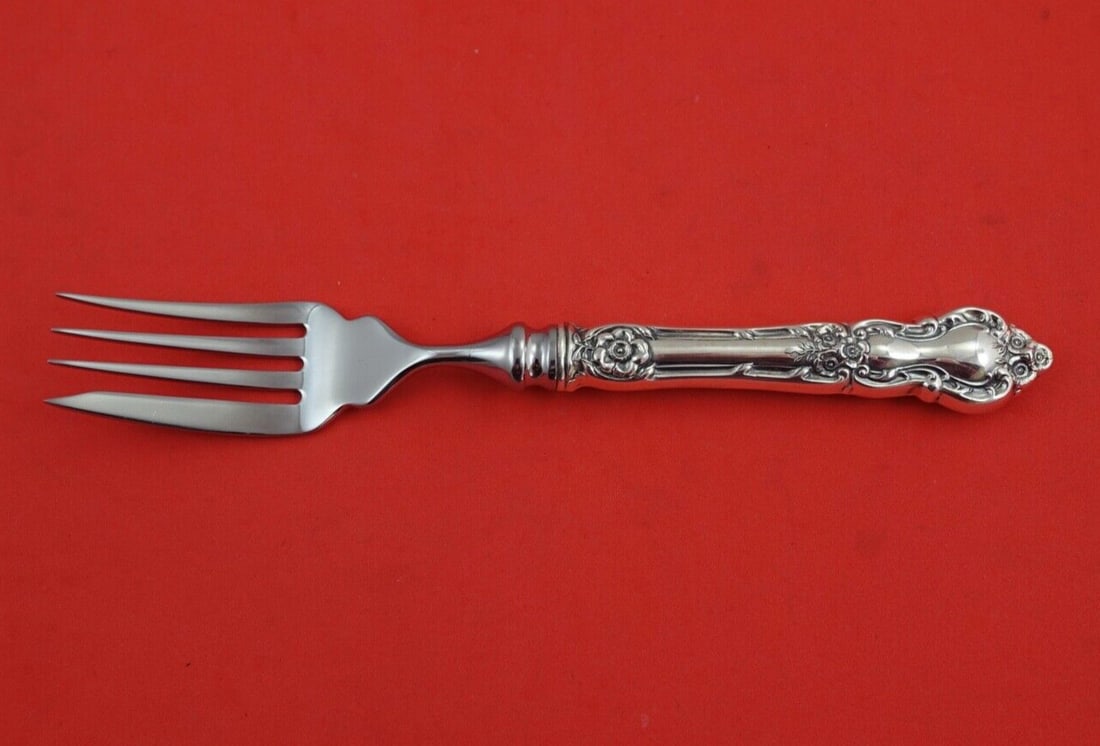 Wallace Meadow Rose Sterling Silver Fish Fork 7 3/4": Wallace Meadow Rose Sterling Silver Fish Fork 7 3/4" This exquisite fish fork is part of the Meadow Rose pattern by Wallace, crafted from sterling silver. It features a hollow handle adorned with a be
