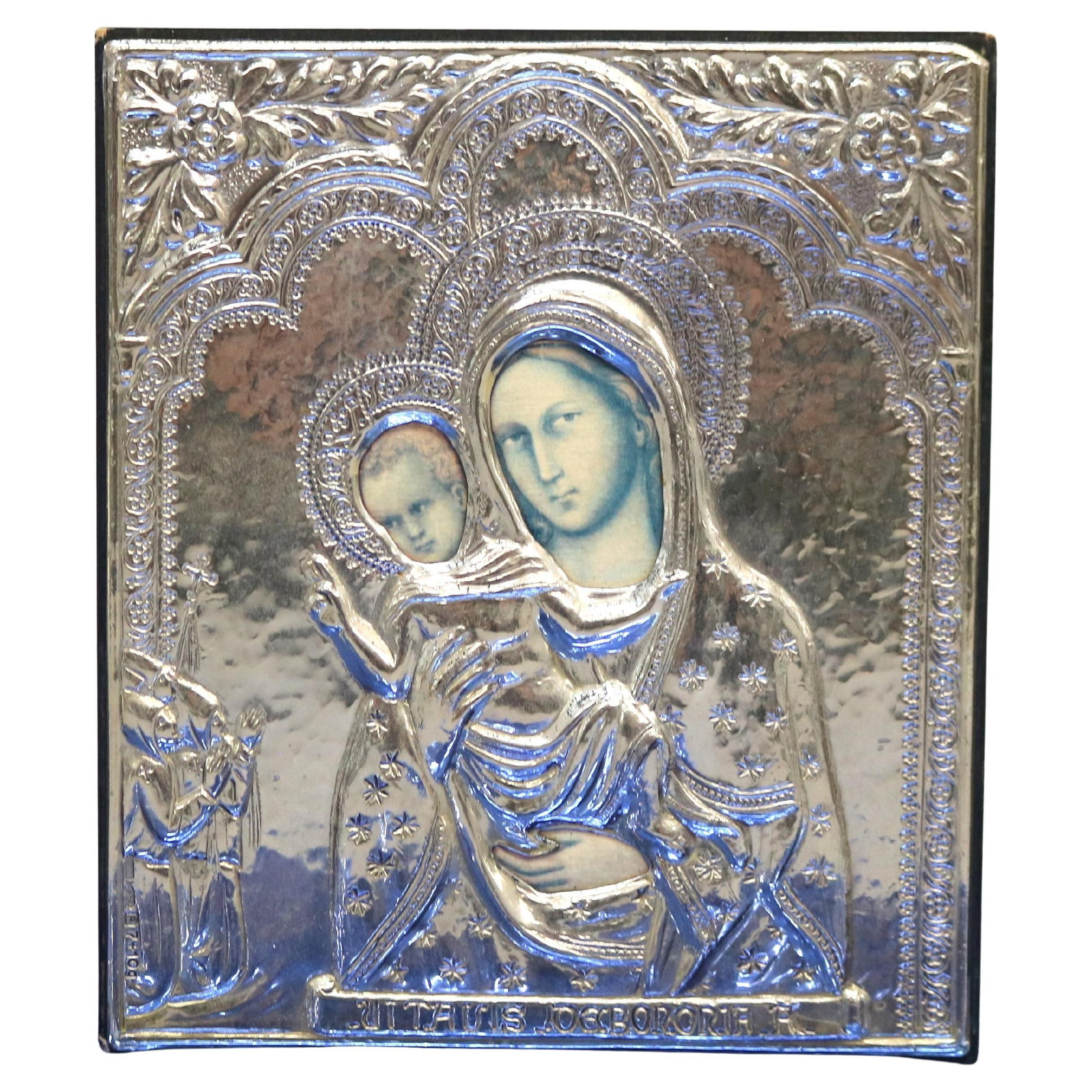 20th Century Hand-Painted Silver Russian Icon with Hallmarks: 20th Century Hand-Painted Silver Russian Icon with Hallmarks This exquisite 20th-century Russian icon showcases a beautifully crafted silver oklad (cover) adorned with intricate repousse work. The ico