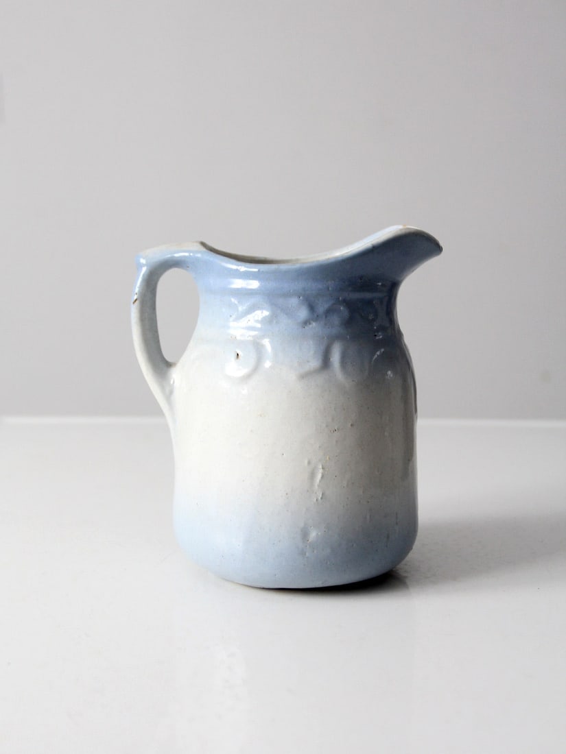 Antique Salt Glaze Pitcher with Blue Accents and Paisley Design: Antique Salt Glaze Pitcher with Blue Accents and Paisley Design This antique salt glaze pitcher features a beautifully crafted raised paisley design at the top, adorned with striking blue salt glaze a