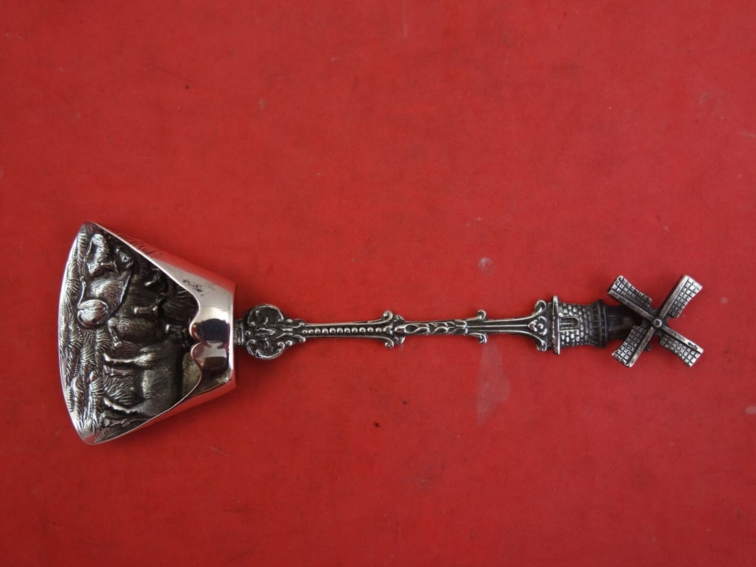 Dutch Sterling Silver Sugar Shovel with Windmill Handle and Cow Design: Dutch Sterling Silver Sugar Shovel with Windmill Handle and Cow Design This exquisite Dutch sterling silver sugar shovel showcases a beautifully crafted spinning windmill handle and charming cows depi