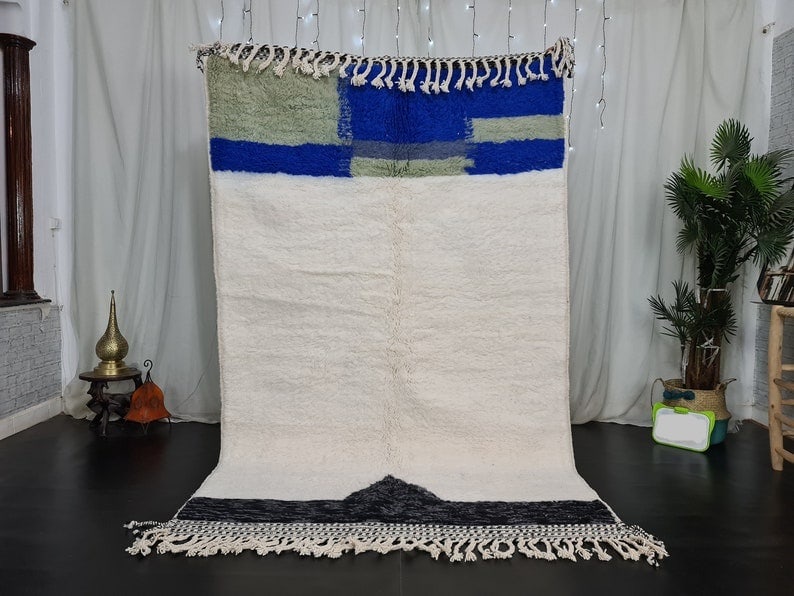 Authentic Handmade Moroccan Berber Wool Area Rug 8 x 5 Feet: Authentic Handmade Moroccan Berber Wool Area Rug 8 x 5 Feet Enhance your living space with this stunning Authentic Handmade Soft Moroccan Berber Wool Area Rug. Crafted by skilled local Berber women we