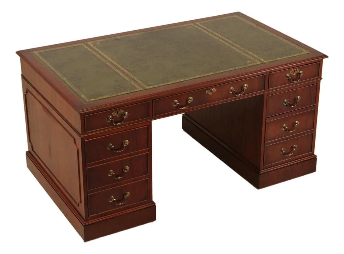 Mahogany Executive Desk with Tooled Green Leather Top English Style: Mahogany Executive Desk with Tooled Green Leather Top English Style This English executive desk features a high-quality tooled green leather top and is crafted from mahogany. With three-part construct