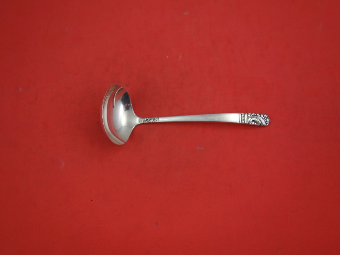 Oneida Mansion House Sterling Silver Sauce Ladle 5.5 Inches: Oneida Mansion House Sterling Silver Sauce Ladle 5.5 Inches Crafted from high-quality sterling silver, this 5 1/2" sauce ladle features the elegant Mansion House pattern by Oneida. It showcases a time