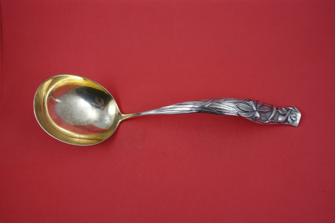 Soup Ladle Sterling Silver Flora Pattern Garden Lily Gold Wash 11 3/8 Inch: Soup Ladle Sterling Silver Flora Pattern Garden Lily Gold Wash 11 3/8 Inch This is a sterling silver soup ladle in the Flora pattern by Shiebler, featuring a garden lily design and a gold-washed bowl.