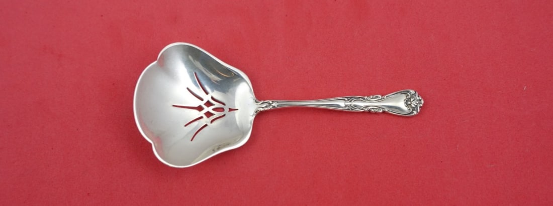 Wallace Sterling Silver Lady Windsor Nut Spoon 4.5": Wallace Sterling Silver Lady Windsor Nut Spoon 4.5" This elegant nut spoon features the Lady Windsor pattern, formerly known as Victoria New, crafted by Wallace. Made from high-quality sterling silver