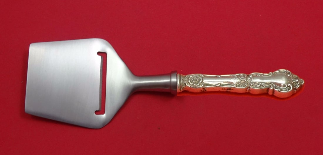 Wallace Meadow Rose Sterling Silver Cheese Plane 8 1/4 Custom Flat Blade: Wallace Meadow Rose Sterling Silver Cheese Plane 8 1/4 Custom Flat Blade This exquisite cheese plane from the Meadow Rose collection by Wallace is crafted from high-quality sterling silver. Featuring