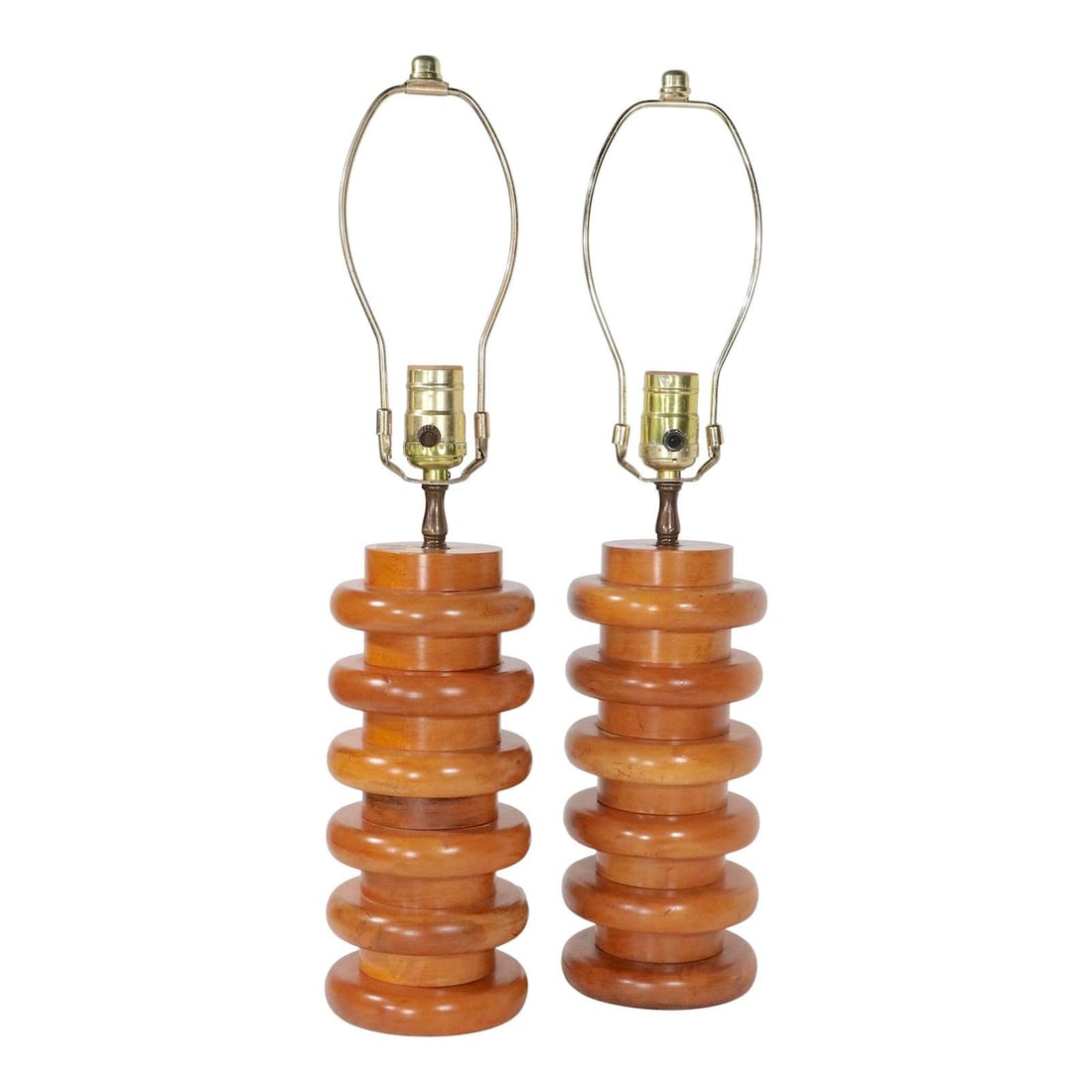 Pair of Stacked Wood Disk Mid Century Table Lamps: Pair of Stacked Wood Disk Mid Century Table Lamps This pair of mid-century modern table lamps features a stacked design crafted from solid hardwood, likely maple, with disk and spacer elements. The la