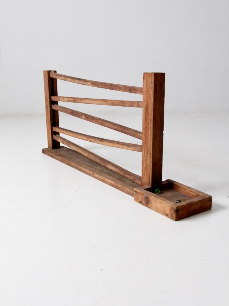 Mid Century Wooden Marble Run with Six Marbles Sculptural Folk Toy: Mid Century Wooden Marble Run with Six Marbles Sculptural Folk Toy This vintage wooden marble run showcases mid-century folk toy craftsmanship, featuring slender rails that create a rhythmic zig-zag p