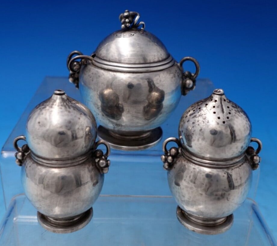 Georg Jensen Ornamental #724 Sterling Silver 3pc Condiment Set: Georg Jensen Ornamental #724 Sterling Silver 3pc Condiment Set Discover the exquisite Ornamental #724 Condiment Set by Georg Jensen, crafted from high-quality sterling silver (.925). This three-piece