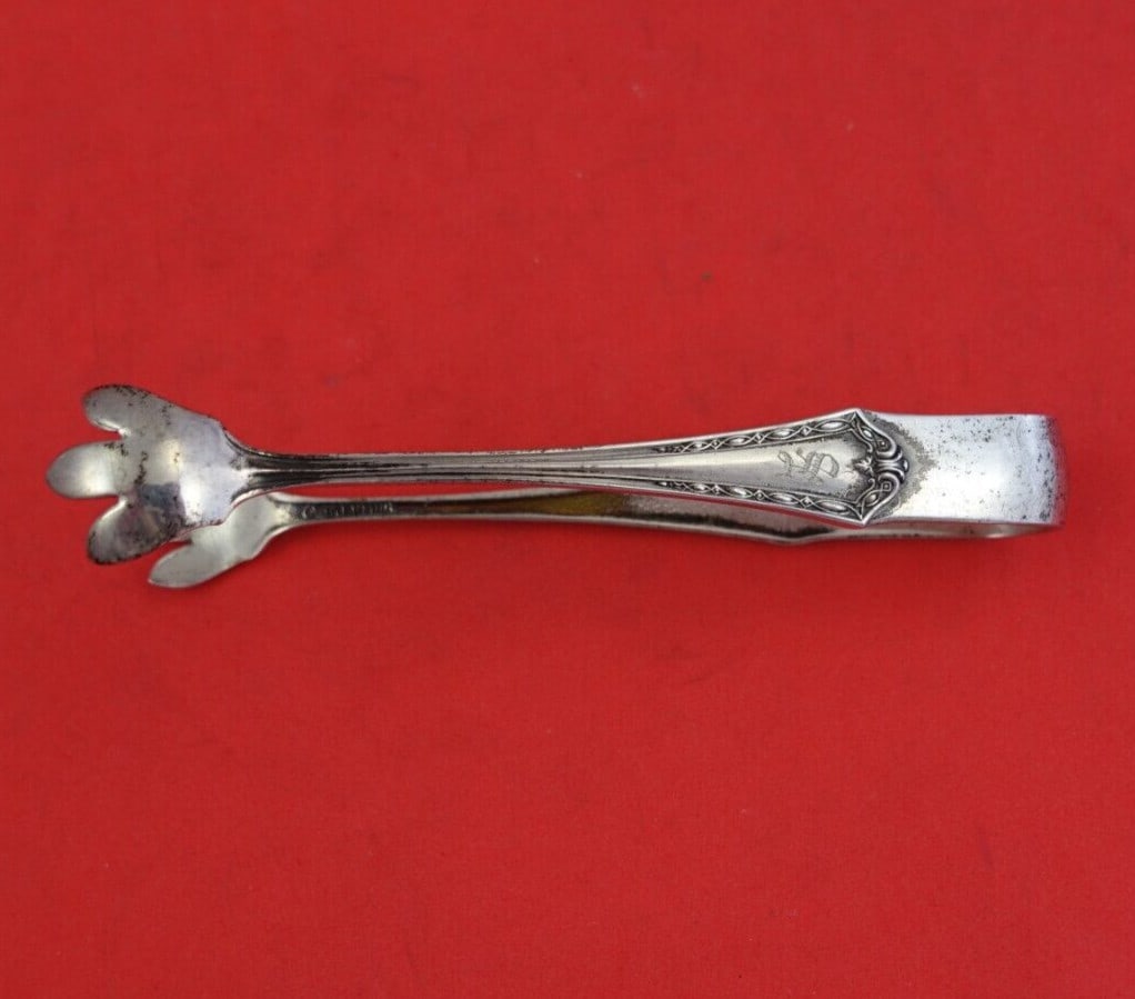 International Florentine Sterling Silver Sugar Tong 4 Inch Serving Piece: International Florentine Sterling Silver Sugar Tong 4 Inch Serving Piece Add elegance to your dining experience with the Florentine Sugar Tong by International. This exquisite 4-inch serving piece is