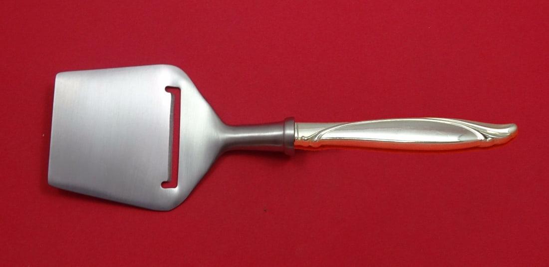 Oneida Sentimental Sterling Silver Cheese Plane Flat Blade 8.25 Inch: Oneida Sentimental Sterling Silver Cheese Plane Flat Blade 8.25 Inch This elegant cheese plane features the Sentimental pattern by Oneida, crafted from high-quality sterling silver. It showcases a hol