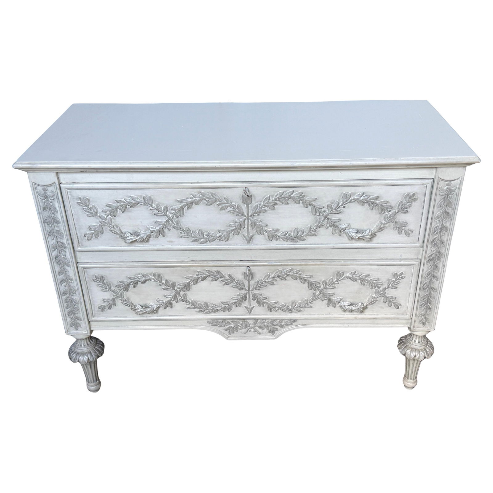 Neoclassical Italian Silver Leaf Chest with Laurel Motifs and Fluted Legs: Neoclassical Italian Silver Leaf Chest with Laurel Motifs and Fluted Legs This Italian hand-carved Tuscan chest is a finely crafted piece inspired by Neoclassical and Grand Tour motifs. Handmade in It