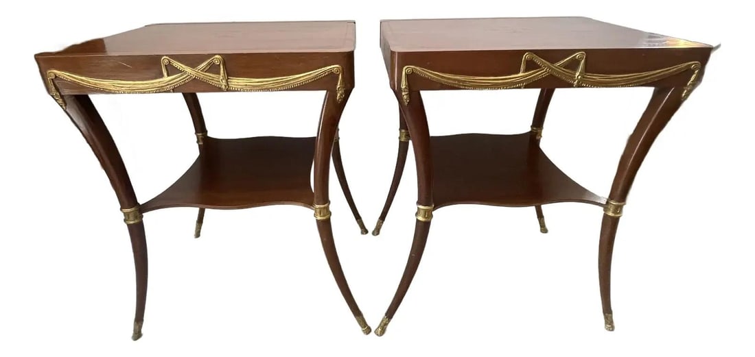 Klismos Leg Side Tables with Tooled Leather and Gilt Wood: Klismos Leg Side Tables with Tooled Leather and Gilt Wood This exquisite pair of Klismos Leg Side Tables features elegant tooled leather tops and ornate gilt wood swags. The two-tier design showcases