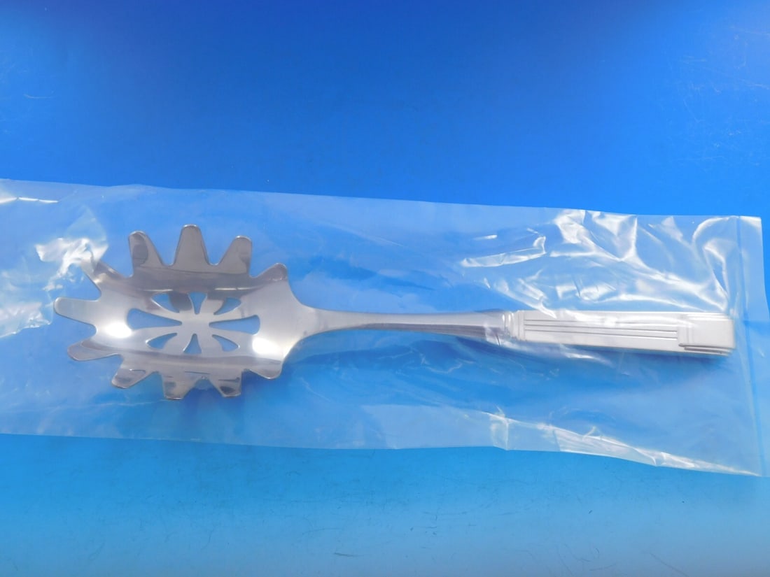 Tiffany & Co Century Sterling Silver Custom Pasta Server 9 7/8": Tiffany & Co Century Sterling Silver Custom Pasta Server 9 7/8" Elevate your dining experience with this exquisite pasta server from Tiffany & Co.'s Century pattern. Crafted from high-quality sterling