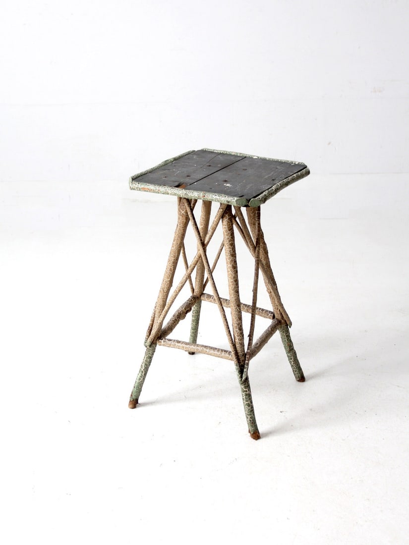 Rustic Antique Adirondack Twig Table with Unique Hand-Painted Legs: Rustic Antique Adirondack Twig Table with Unique Hand-Painted Legs Discover the charm of this Antique Adirondack-style Twig Table, a stunning piece that showcases the artistry of folk craftsmanship. T