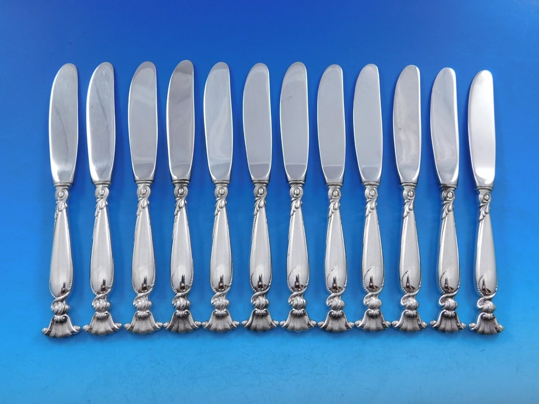 Wallace Romance of the Sea Sterling Silver Butter Spreader Set 12 pcs: Wallace Romance of the Sea Sterling Silver Butter Spreader Set 12 pcs Enhance your dining experience with this elegant set of 12 butter spreaders from the Romance of the Sea pattern by Wallace. Crafte