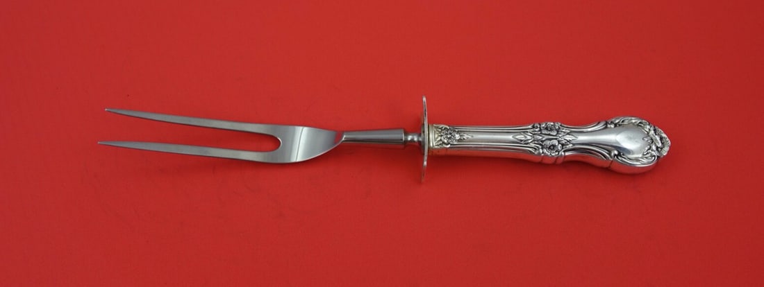 International Sterling Silver Wild Rose Steak Carving Fork 8 3/4": International Sterling Silver Wild Rose Steak Carving Fork 8 3/4" Enhance your dining experience with this exquisite Wild Rose serving fork from International Sterling. Crafted in post-1940, this piec