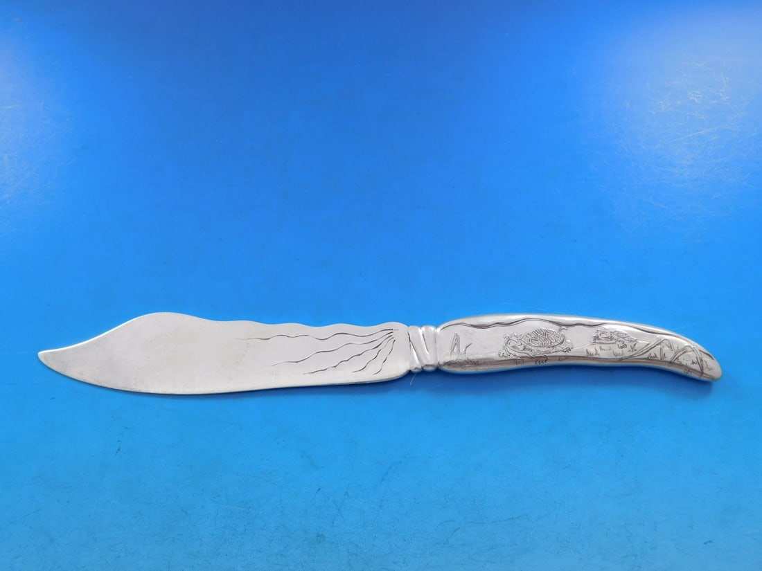Tiffany Sterling Silver Fish Knife Lap Over Edge Two Turtles 7 7/8": Tiffany Sterling Silver Fish Knife Lap Over Edge Two Turtles 7 7/8" This exquisite Lap Over Acid Etched Fish Knife by Tiffany & Co. showcases a stunning design with two turtles and a grass motif engra