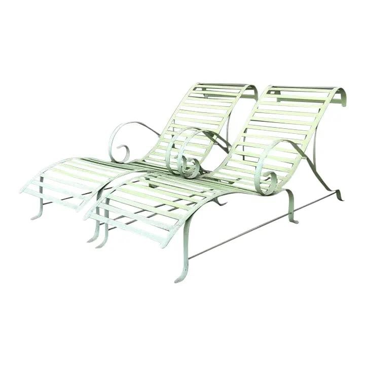 Pair of Mid-Century Wave Chaise Lounges in Cast Aluminum: Pair of Mid-Century Wave Chaise Lounges in Cast Aluminum This pair of vintage cast aluminum chaise lounge chairs features the iconic "Wave" silhouette, characterized by graceful S-curve profiles and e
