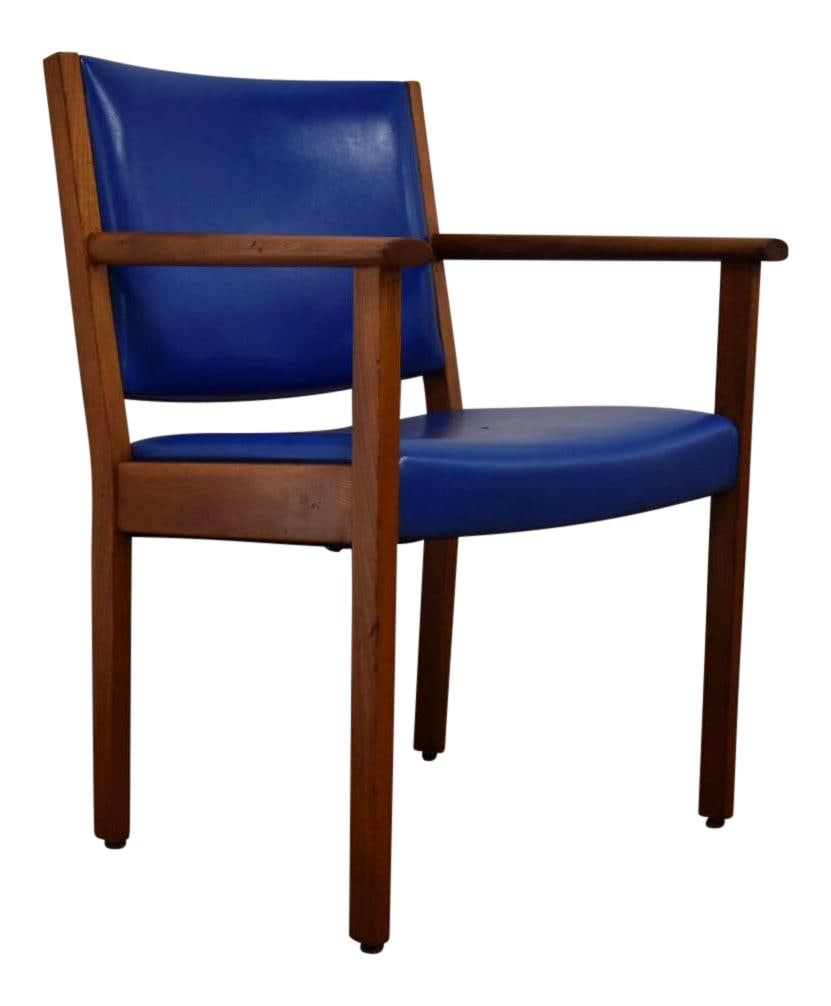 1970s Johnson Teak Desk Chair with Blue Vinyl Upholstery: 1970s Johnson Teak Desk Chair with Blue Vinyl Upholstery This 1970s Danish Style Teak Desk Chair showcases a classic mid-century modern design, expertly crafted by Johnson Chair Company. The chair fea