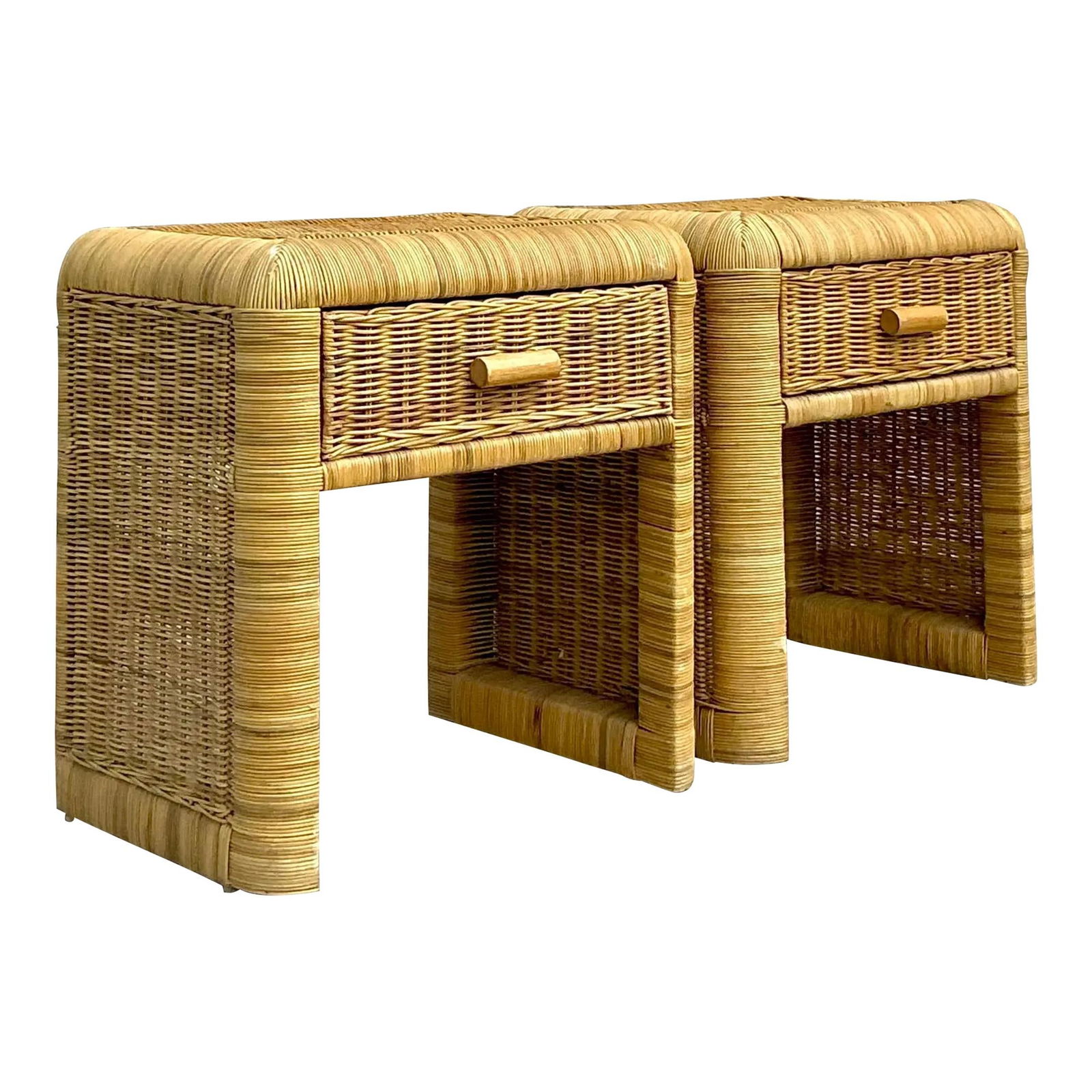 Charming Pair of Vintage Woven Rattan Nightstands: Charming Pair of Vintage Woven Rattan Nightstands Enhance your living space with this exquisite pair of vintage coastal woven rattan nightstands. Each nightstand features a sturdy frame wrapped in war
