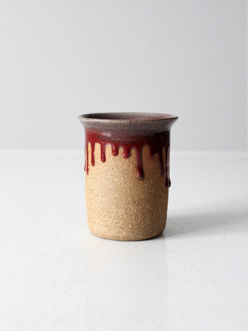 Beaver Creek Vintage Studio Pottery Vase Burgundy Drip Glaze 4": Beaver Creek Vintage Studio Pottery Vase Burgundy Drip Glaze 4" This vintage Beaver Creek studio pottery vase showcases a unique handmade design, featuring an unglazed exterior complemented by a rich