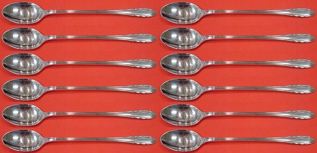 Gorham Lyric Sterling Silver Iced Tea Spoon Set 12 Pieces 7 5/8": Gorham Lyric Sterling Silver Iced Tea Spoon Set 12 Pieces 7 5/8" Enhance your tea experience with this exquisite 12-piece iced tea spoon set from the Lyric pattern by Gorham. Crafted from high-quality