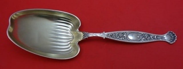 Whiting Hyperion Sterling Silver Gold Washed Preserve Spoon 7 1/4": Whiting Hyperion Sterling Silver Gold Washed Preserve Spoon 7 1/4" This exquisite serving spoon features the elegant Hyperion pattern by Whiting, crafted from high-quality sterling silver and enhanced