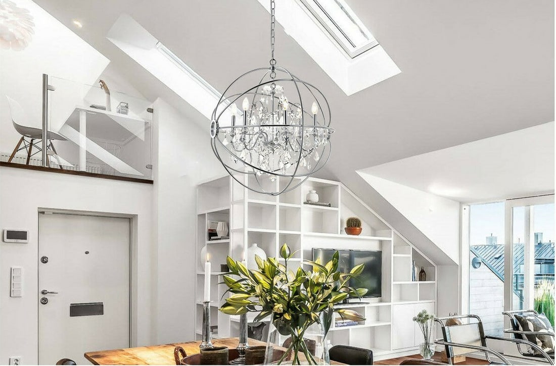 Cordelia 6-Light Chrome Crystal Globe Chandelier for Dining or Living Room: Cordelia 6-Light Chrome Crystal Globe Chandelier for Dining or Living Room This modern chandelier features a round globe design with a chrome metal frame accented by clear Royal Cut crystals. It accom