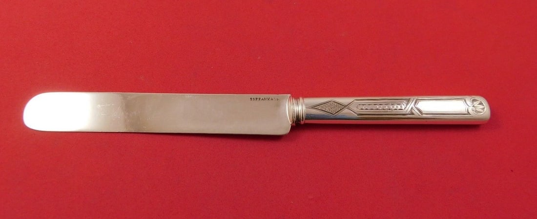 Tiffany & Co. Sterling Silver Hollow Handle Tea Knife 7 3/4": Tiffany & Co. Sterling Silver Hollow Handle Tea Knife 7 3/4" This exquisite tea knife from Tiffany & Co. features a hollow handle made entirely of sterling silver, measuring 7 3/4" in length. Adorned