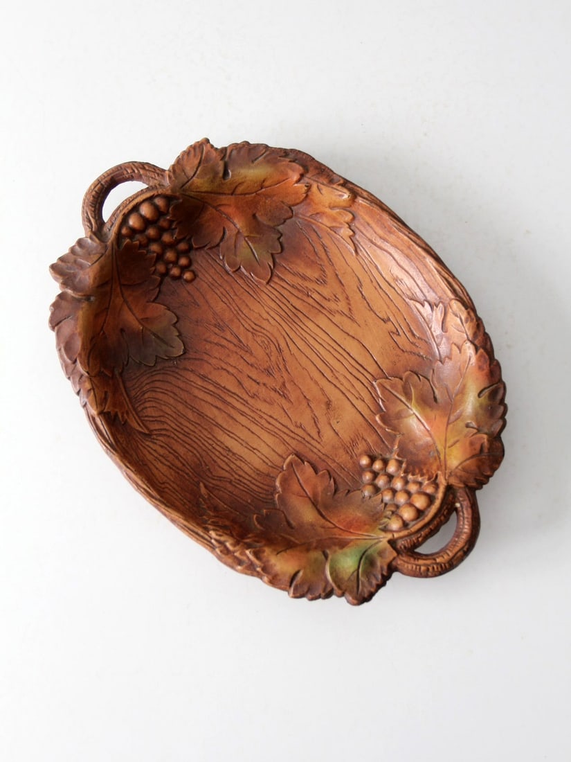 1940s Vintage Cast Wood Leaf Bowl with Grapevine Design: 1940s Vintage Cast Wood Leaf Bowl with Grapevine Design Enhance your table setting with this Vintage Decorative Cast Wood Leaf Bowl, a charming piece from the 1940s. This versatile tray, crafted from