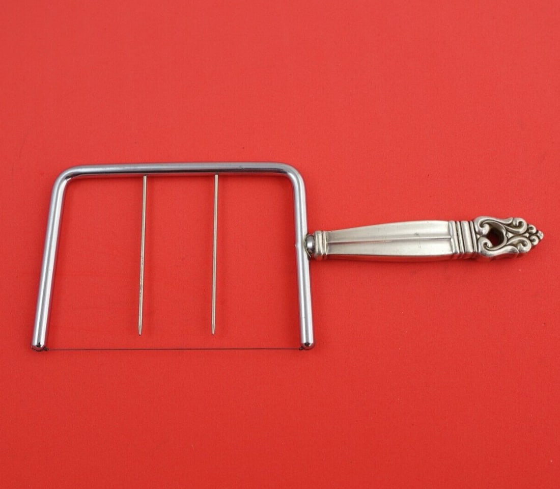International Royal Danish Sterling Silver Cheese Wire 8 3/8": International Royal Danish Sterling Silver Cheese Wire 8 3/8" Elevate your cheese serving experience with this exquisite cheese wire from the Royal Danish pattern by International. Crafted from high-q