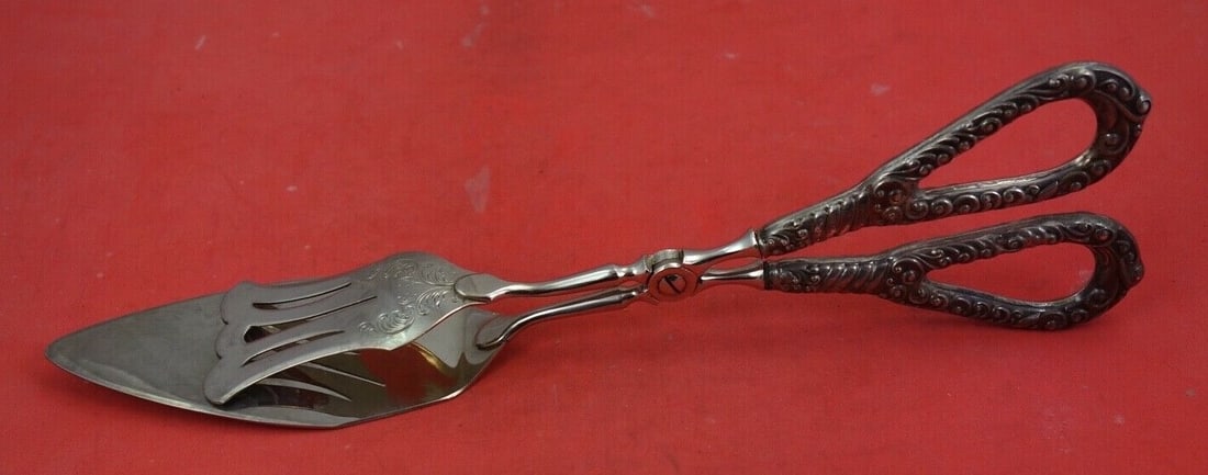 Sterling Silver Pastry Tongs 10 Inch Engraved Scroll Handle: Sterling Silver Pastry Tongs 10 Inch Engraved Scroll Handle This exquisite set of pastry tongs features a stunning sterling silver construction, characterized by a beautifully engraved scroll handle a