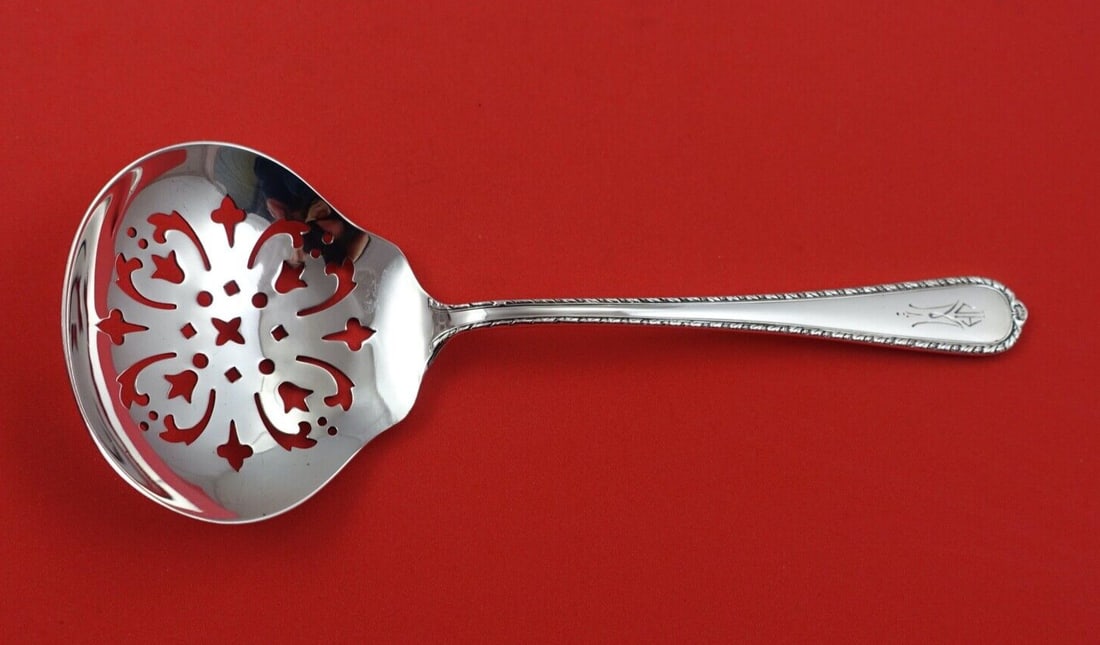 International Sterling Silver Pine Tree Nut Spoon Monogram 5 7/8": International Sterling Silver Pine Tree Nut Spoon Monogram 5 7/8" This exquisite Pine Tree nut spoon is crafted from high-quality sterling silver and features the elegant Pine Tree pattern by Internat