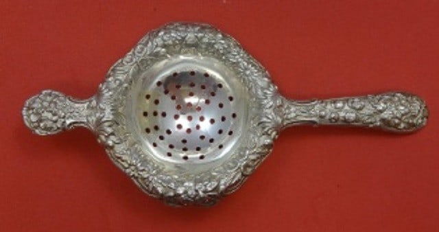 Kirk Repousse Sterling Silver Tea Strainer 6 7/8 inches: Kirk Repousse Sterling Silver Tea Strainer 6 7/8 inches Experience the elegance of the Repousse by Kirk Sterling Silver Tea Strainer, measuring 6 7/8 inches. Crafted from high-quality sterling silver,