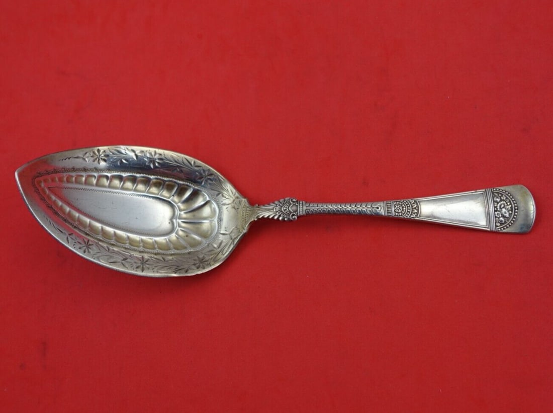Gorham Empress Sterling Silver Bright-Cut Serving Spoon 7 5/8": Gorham Empress Sterling Silver Bright-Cut Serving Spoon 7 5/8" This exquisite serving spoon, part of the Empress pattern by Gorham, is a stunning example of Victorian-era craftsmanship. Made from high