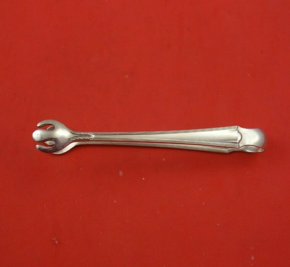 Lunt American Directoire Sterling Silver Sugar Tong 4.25" Serving Piece: Lunt American Directoire Sterling Silver Sugar Tong 4.25" Serving Piece Add a touch of elegance to your table setting with this American Directoire Sterling Silver Sugar Tong by Lunt. Measuring 4 1/4