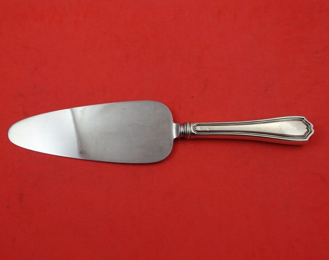 Reed and Barton Hepplewhite Sterling Silver Cake Server 10 3/4": Reed and Barton Hepplewhite Sterling Silver Cake Server 10 3/4" This exquisite Hepplewhite cake server by Reed and Barton features a sterling silver hollow handle complemented by a stainless steel bla
