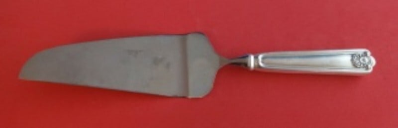 Frank Smith Fiddle Shell Sterling Silver Pie Server 10.5": Frank Smith Fiddle Shell Sterling Silver Pie Server 10.5" This exquisite pie server features the elegant Fiddle Shell pattern by Frank Smith, crafted from high-quality sterling silver. The server show