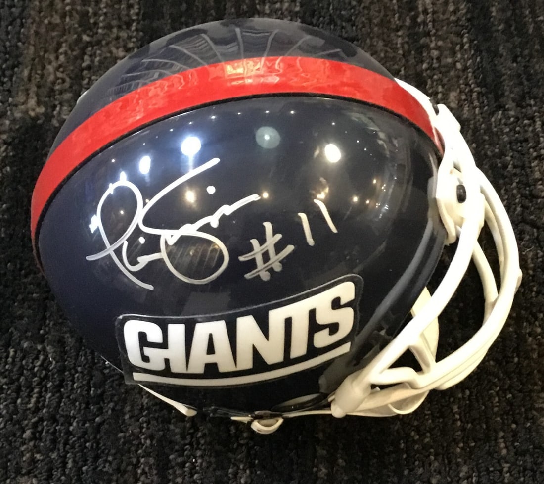 Phil Simms New York Giants Signed Mini Helmet JSA Authenticated: Phil Simms New York Giants Signed Mini Helmet JSA Authenticated This collectible features a signed mini helmet by Phil Simms, a renowned player for the New York Giants. The helmet is authenticated by